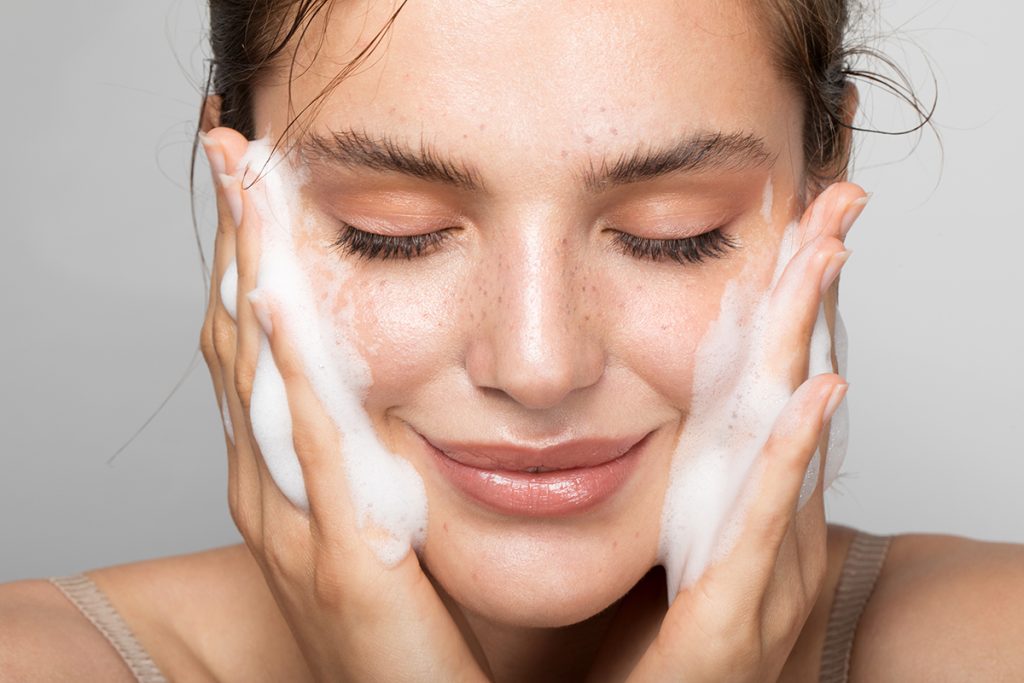 woman cleaning her pores