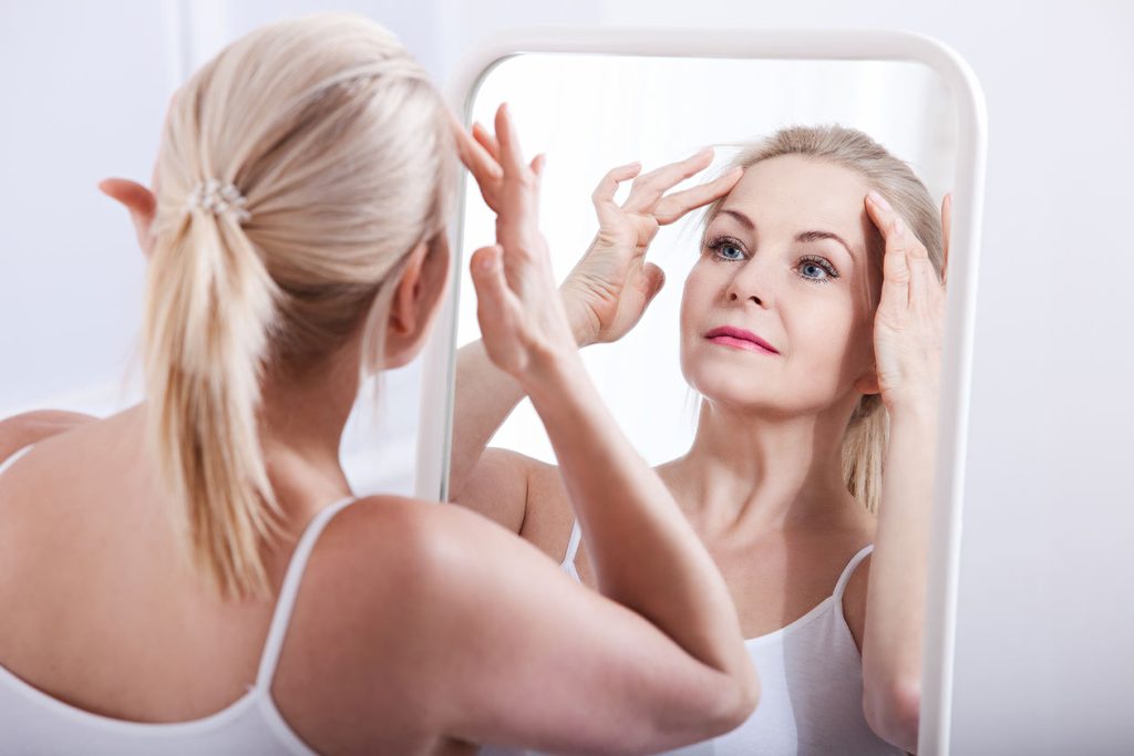 Woman admiring her. Mini Facelift Skin and Vein.